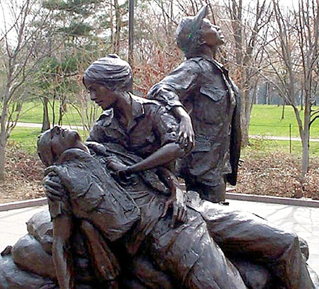 The Vietnam Women's Memorial was designed by Glenna Goodacre and dedicated on November 11, 1993. It is part of the Vietnam Veterans Memorial, and is located on National Mall in Washington DC, a short distance south of The Wall, north of the Reflecting Pool. Photo by Rudi Williams (American Forces Press Service).
